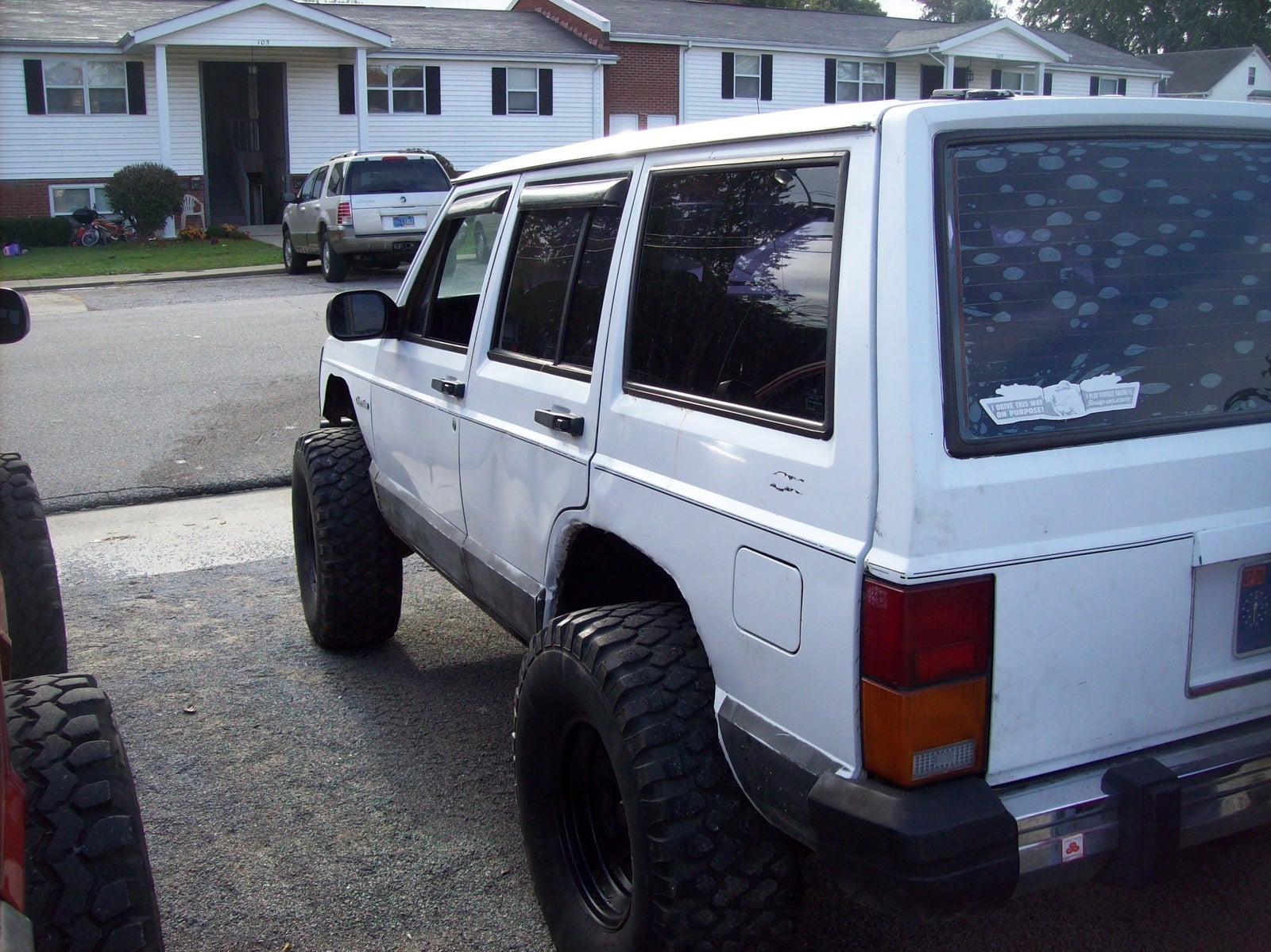 1991 Jeep Cherokee 4 Dr Limited 4WD SUV, the 33s went on the maroon jeep