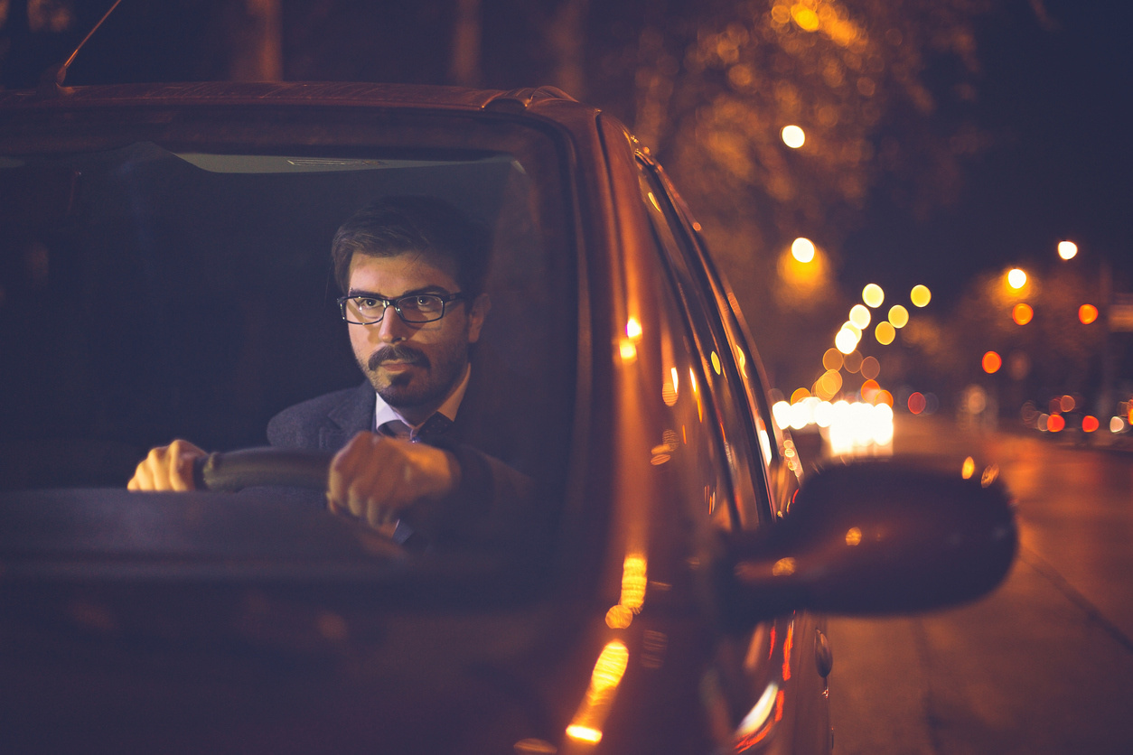 Night Car With Bright Headlights Approaching In The Dark