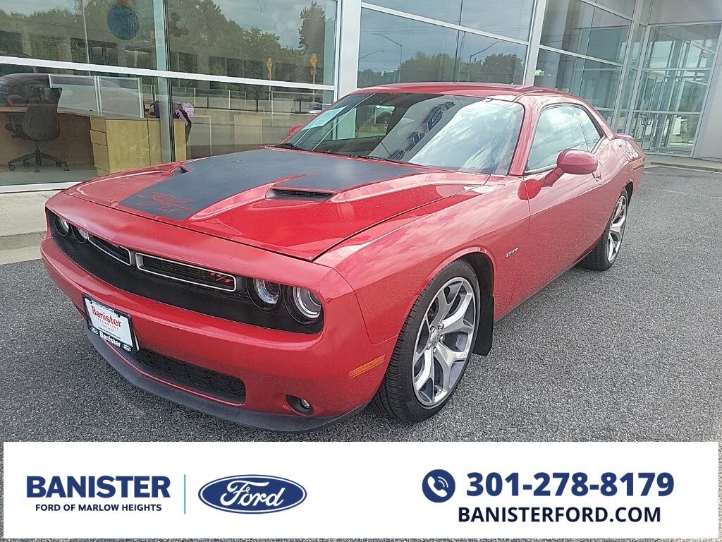 Premium Vector  A blue dodge challenger car with a pink background.