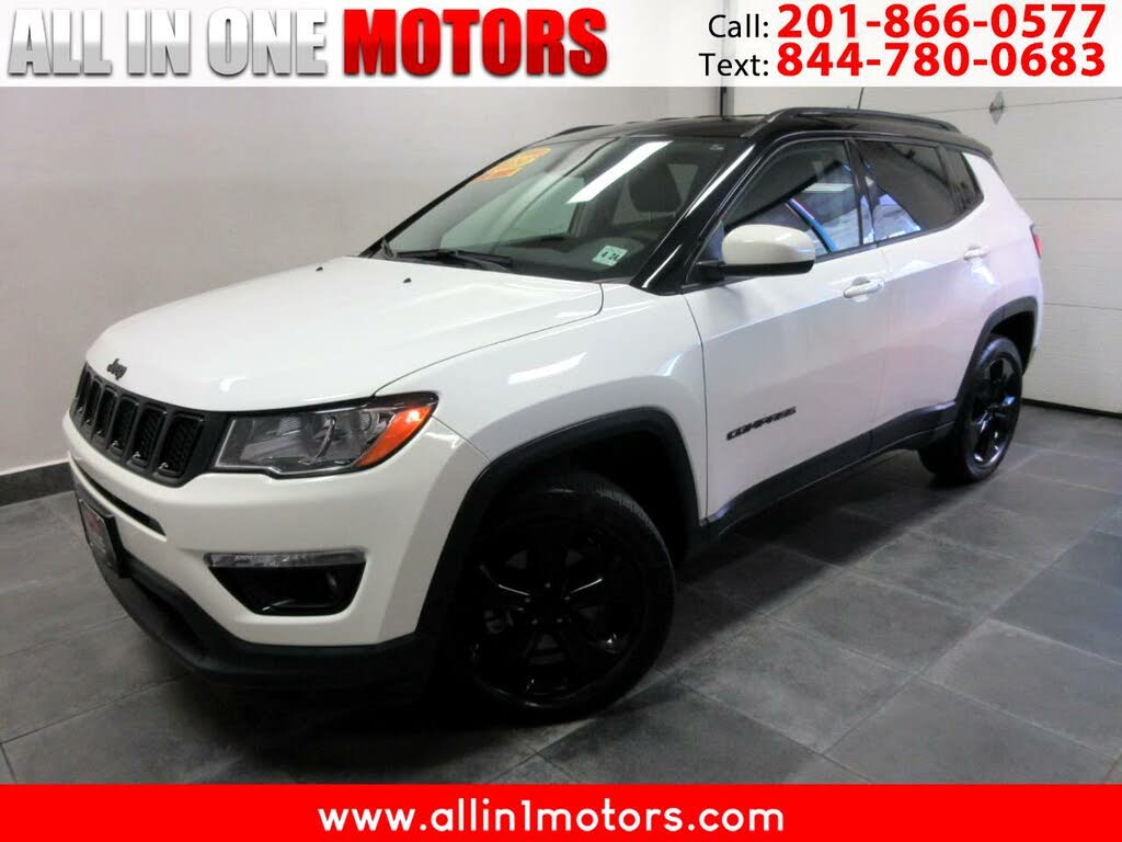 Jeep compass white with black outlet roof