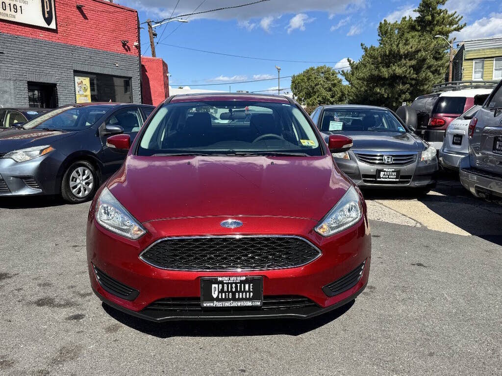 Ruby Red Metallic Tinted Clearcoat 2015 Ford Focus Sedan Front-Wheel Drive 6-Speed Automatic