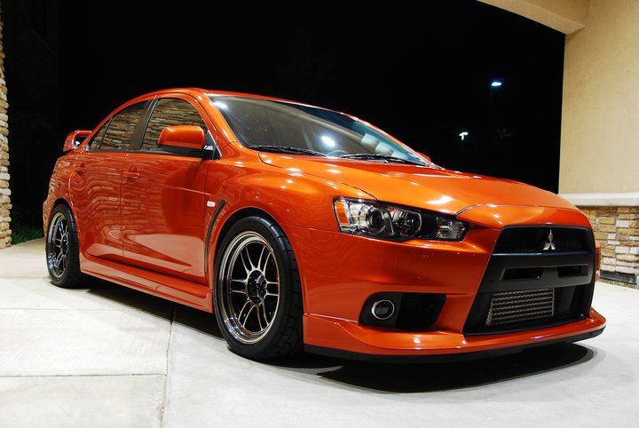 Mitsubishi m. Mitsubishi Lancer Evolution 2010. Lancer 2010 EVO. Lancer Evolution 10 оранжевый. Лансер Эволюшн 10 оранжевый.