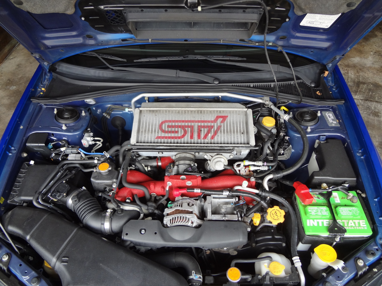 Двигатели субару какой лучше. Subaru Impreza WRX-STI 2006 двигатель. Мотор Субару Импреза WRX STI. Двигатель Субару Импреза WRX STI 2.5. Subaru Impreza WRX STI двигатель.