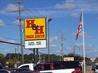 H and H Truck Center logo