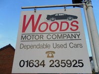 Woods Motor Company logo